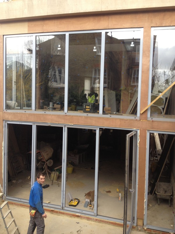 Aluminium bi-fold doors with two-storey glazing in Shepherd's Bush