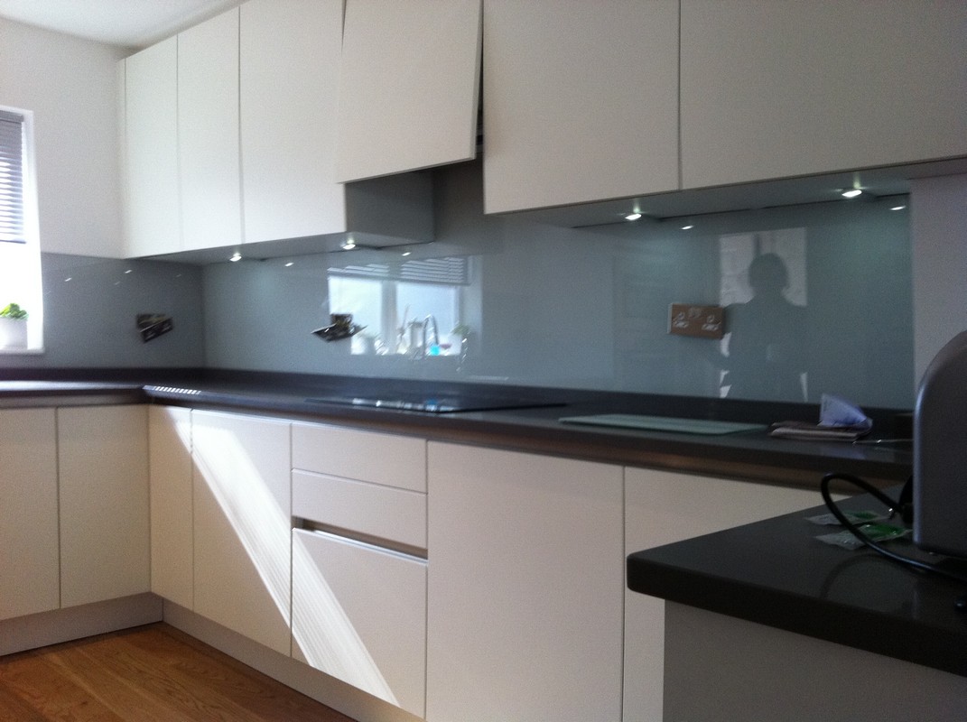Grey glass kitchen splashback with LED lighting in Shepherd's Bush
